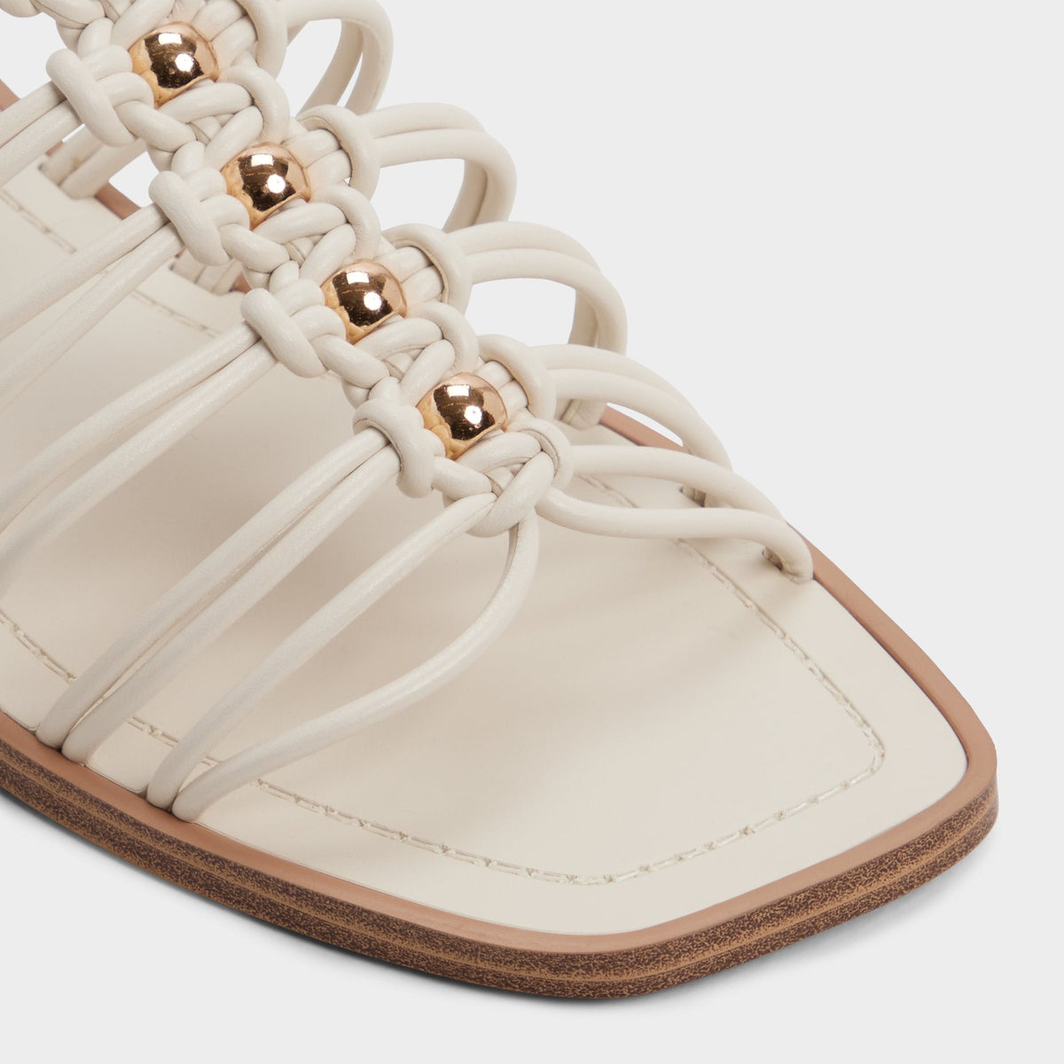Unoma in White Bone - Strappy flat sandal | Aldo Classic